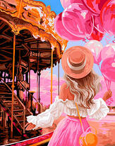Девушка с розовыми шариками возле карусели